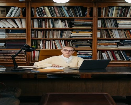 Vintage medical books and eyeglasses on wooden table